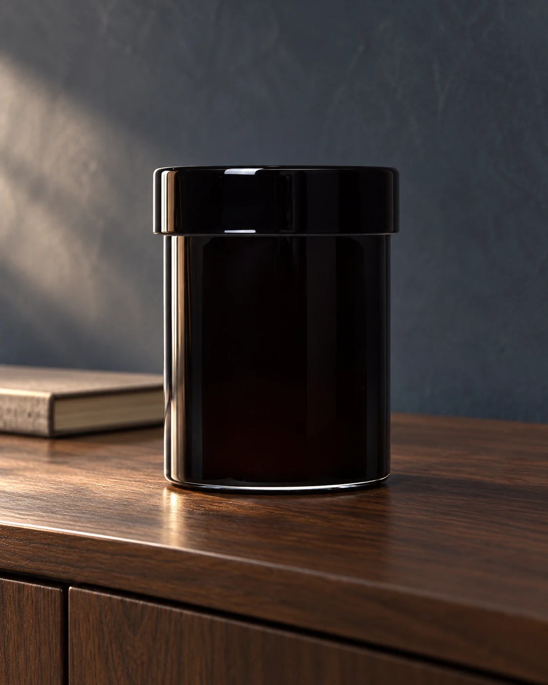 Black lidded vessel in a styled setting